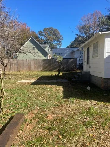 a view of a back yard of the house