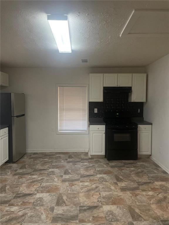 2294 Bouldercrest Road Atlanta, GA 30316 - Photo 5 of 12 a kitchen with a refrigerator and a sink