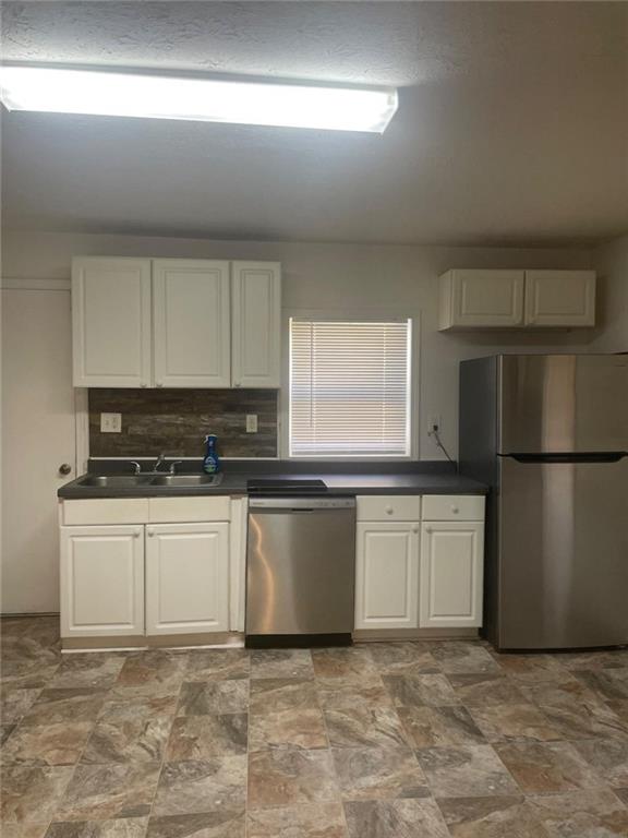 2294 Bouldercrest Road Atlanta, GA 30316 - Photo 6 of 12 a kitchen with stainless steel appliances granite countertop a stove a sink and a refrigerator