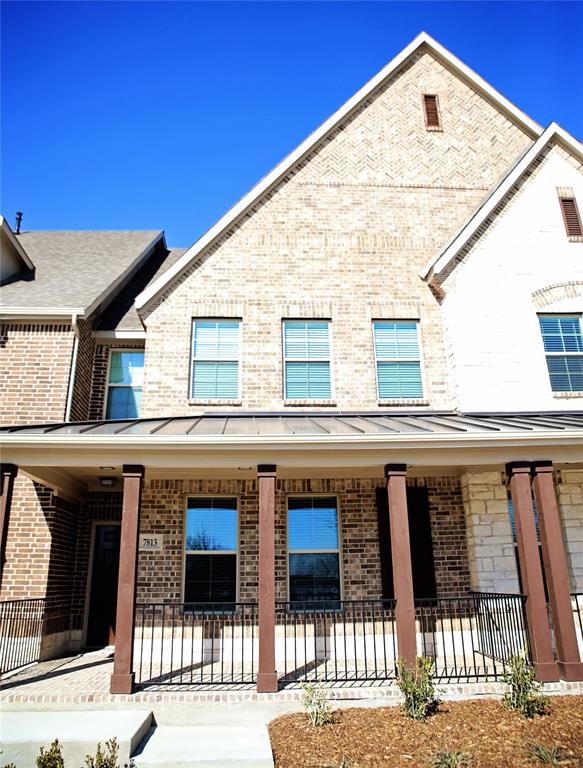 7813 Sunset Boulevard Rowlett, TX 75088 - Photo 1 of 1 a front view of a house with a balcony