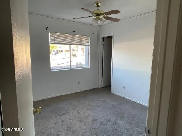 a view of an empty room with a window