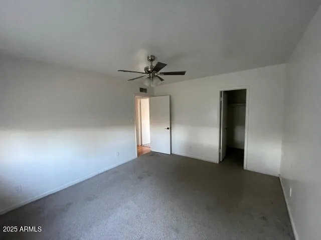 a view of a livingroom with a ceiling fan
