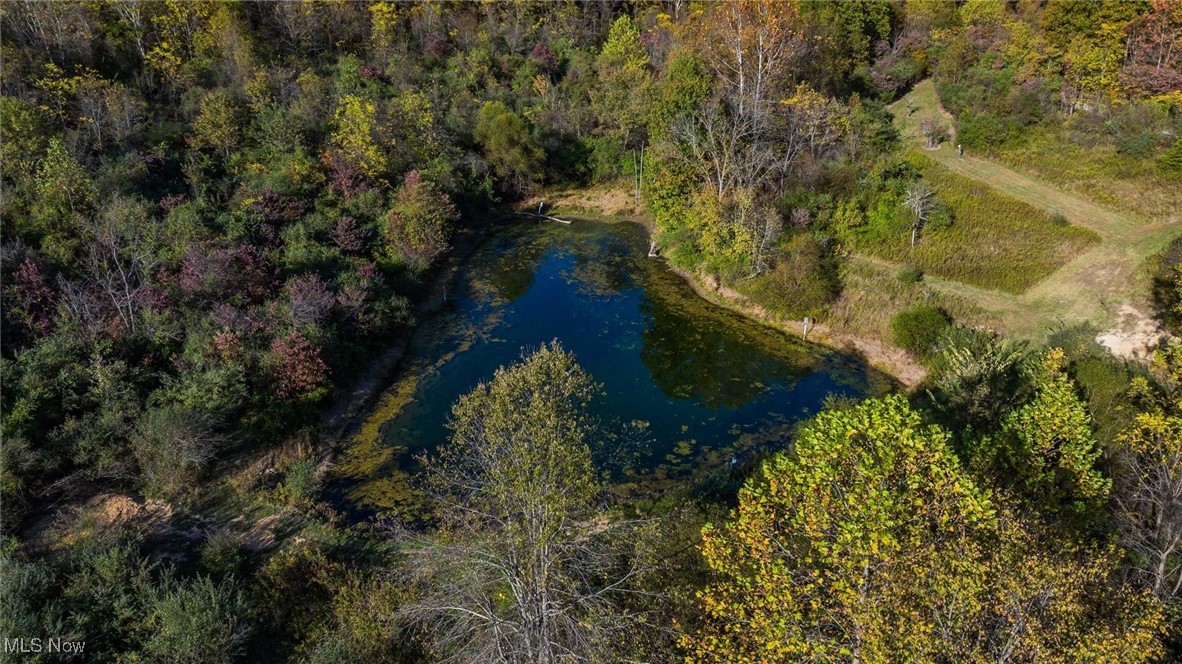 3278 Rough And Ready Road New Concord, OH 43762 - Photo 22 of 28 Drone / aerial view of a nearby body of water