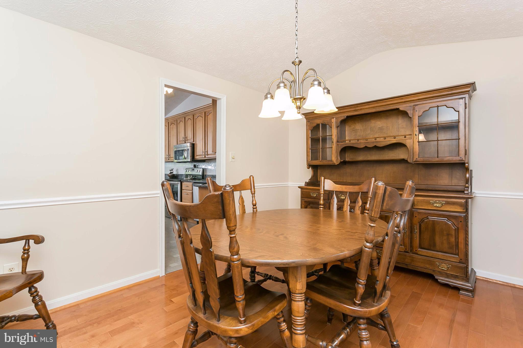 9421 Gunview Road Baltimore, MD 21236 - Photo 11 of 30 Chair railing and updated fixtures.