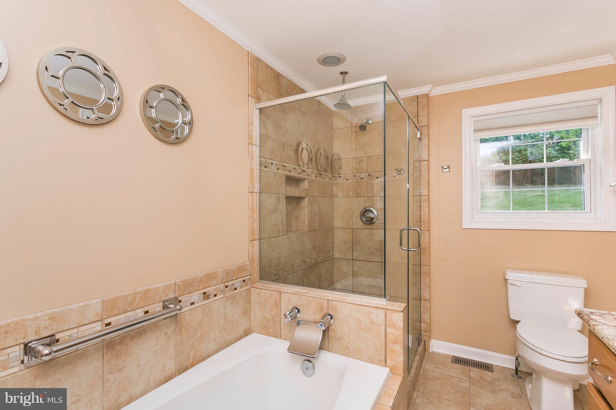 9421 Gunview Road Baltimore, MD 21236 - Photo 15 of 30 The master bathroom includes a separate shower.