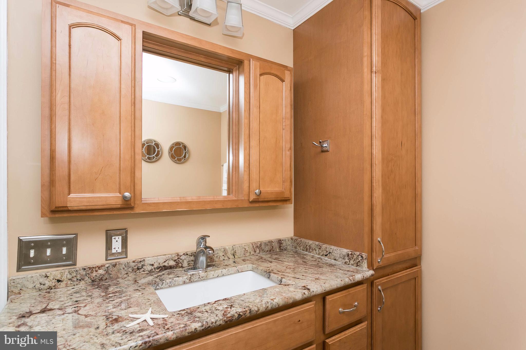 9421 Gunview Road Baltimore, MD 21236 - Photo 16 of 30 Granite counter w/ maple base & hamper pantry.