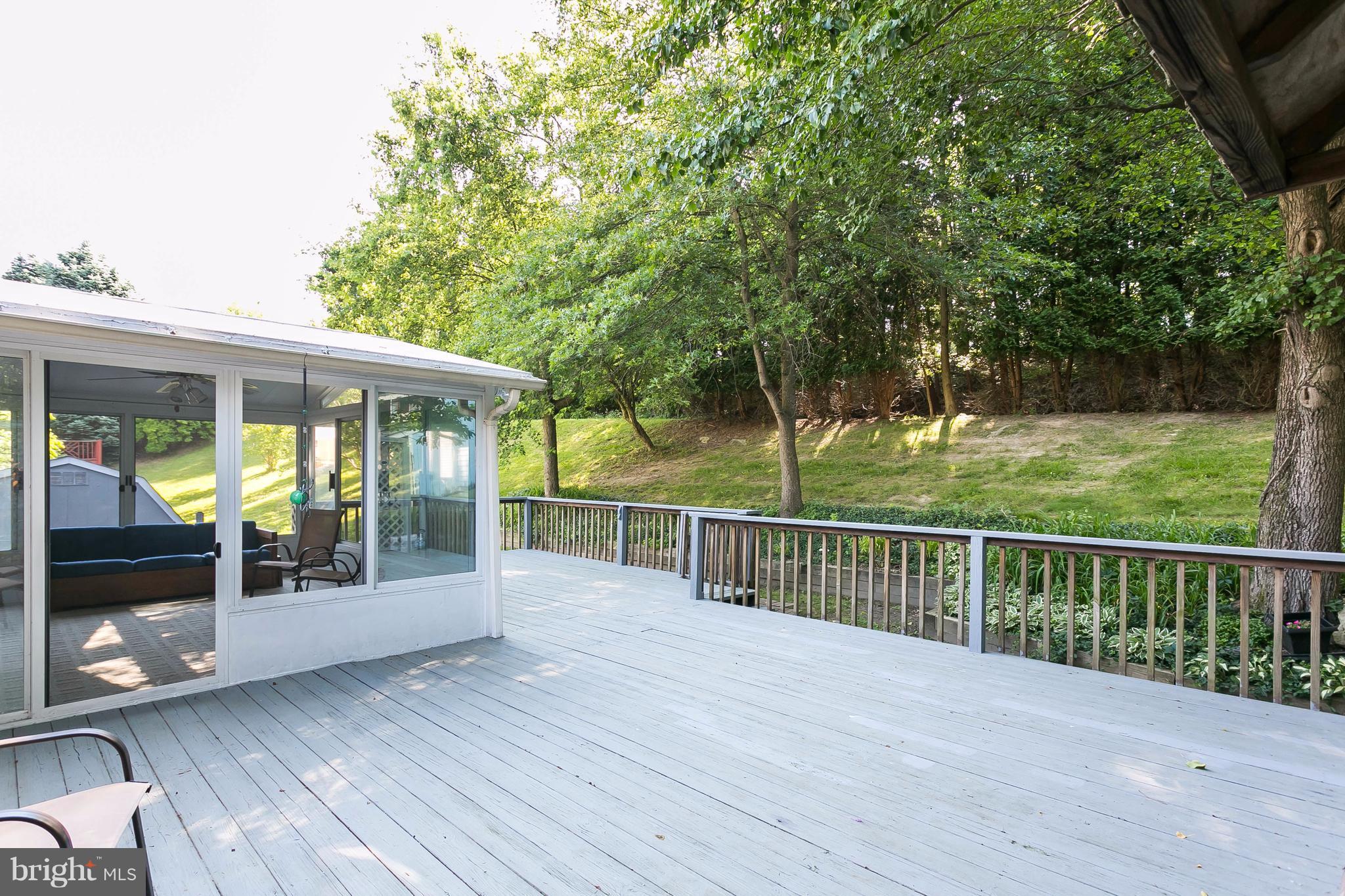 9421 Gunview Road Baltimore, MD 21236 - Photo 27 of 30 Large deck off of the patio enclosure