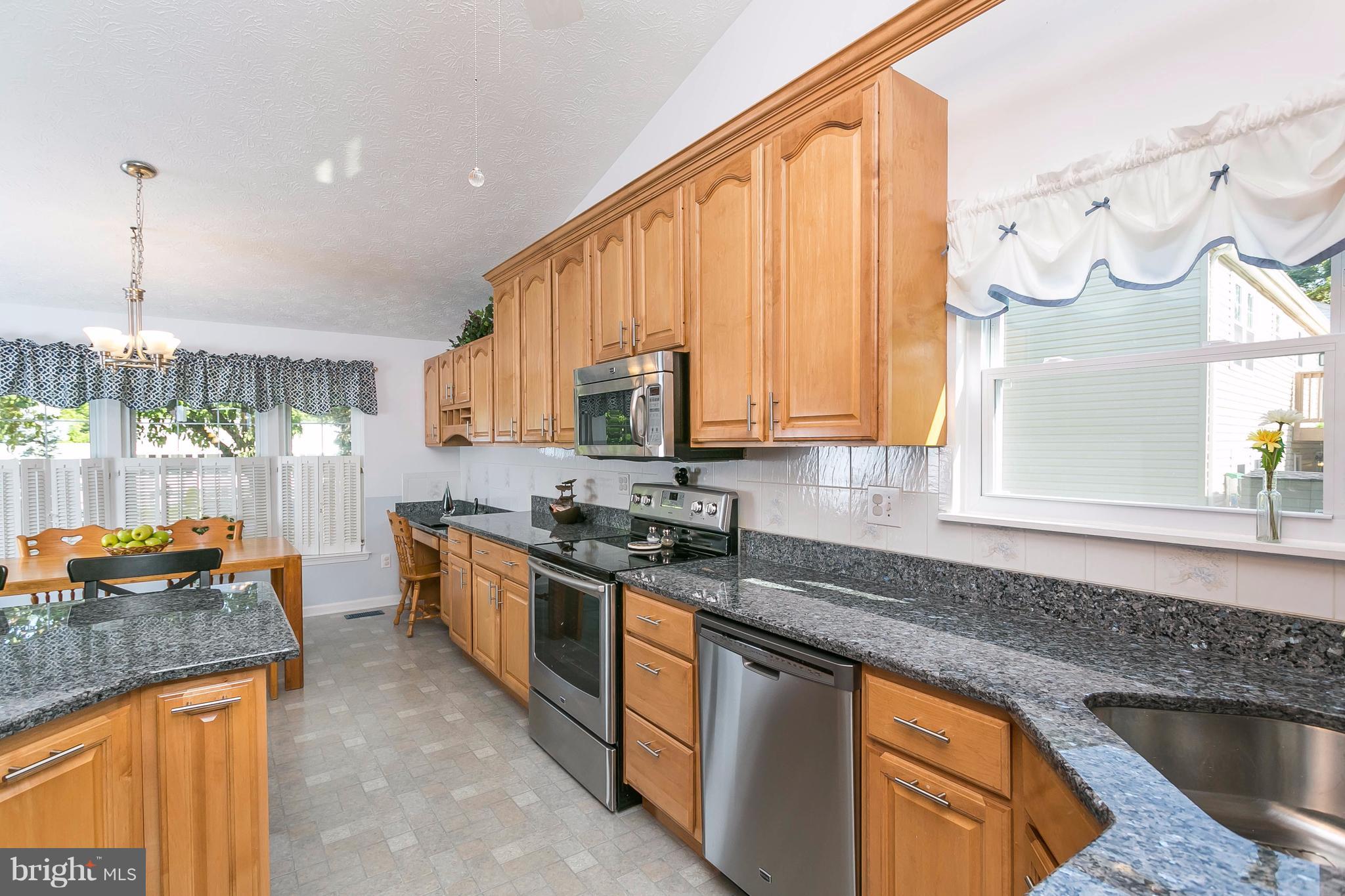 9421 Gunview Road Baltimore, MD 21236 - Photo 5 of 30 Granite counters and stainless steel appliances.