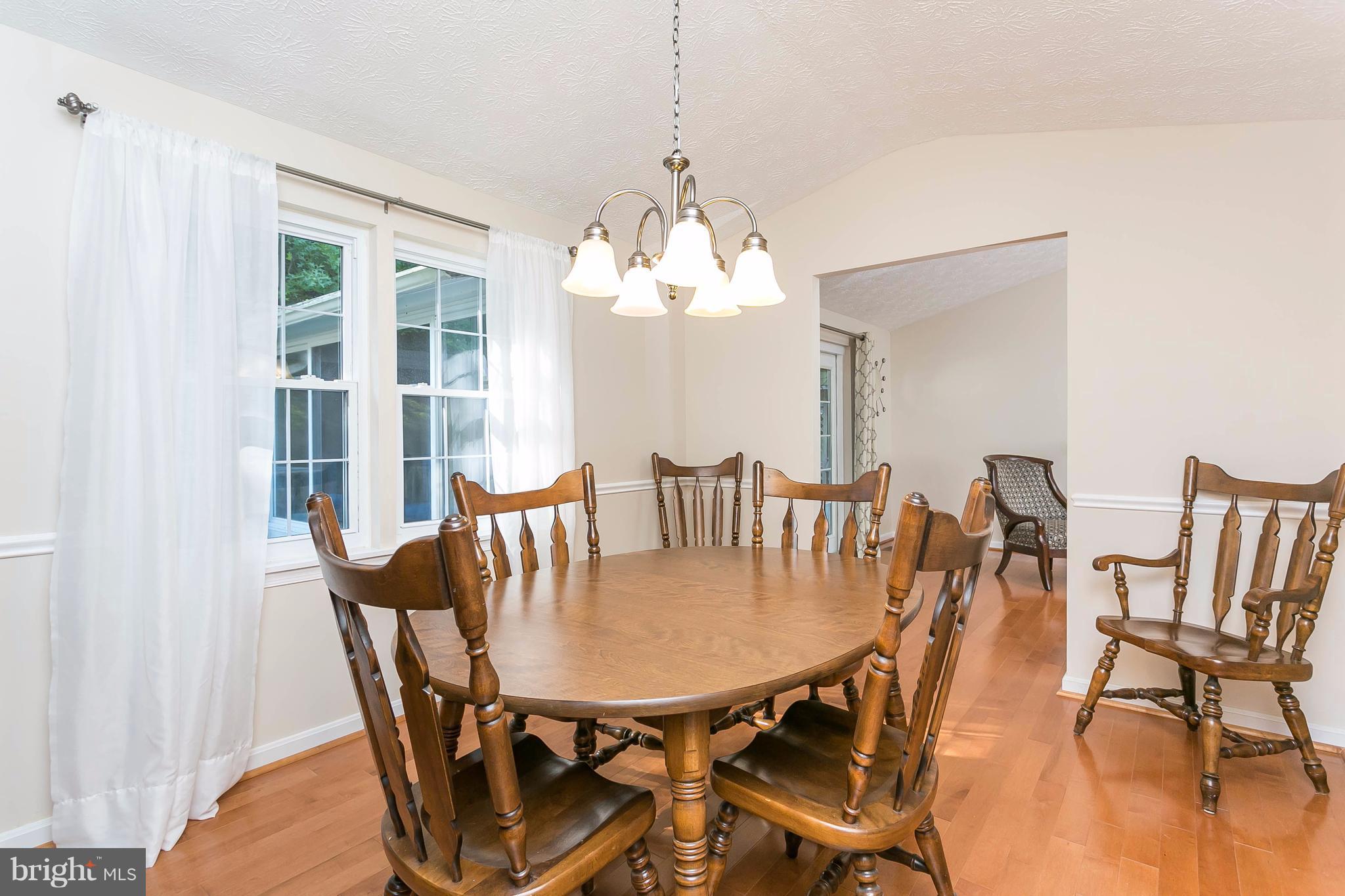 9421 Gunview Road Baltimore, MD 21236 - Photo 10 of 30 Formal dining room with hardwood floors.