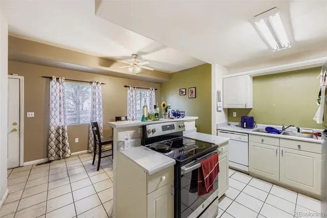 a kitchen with a stove and a refrigerator