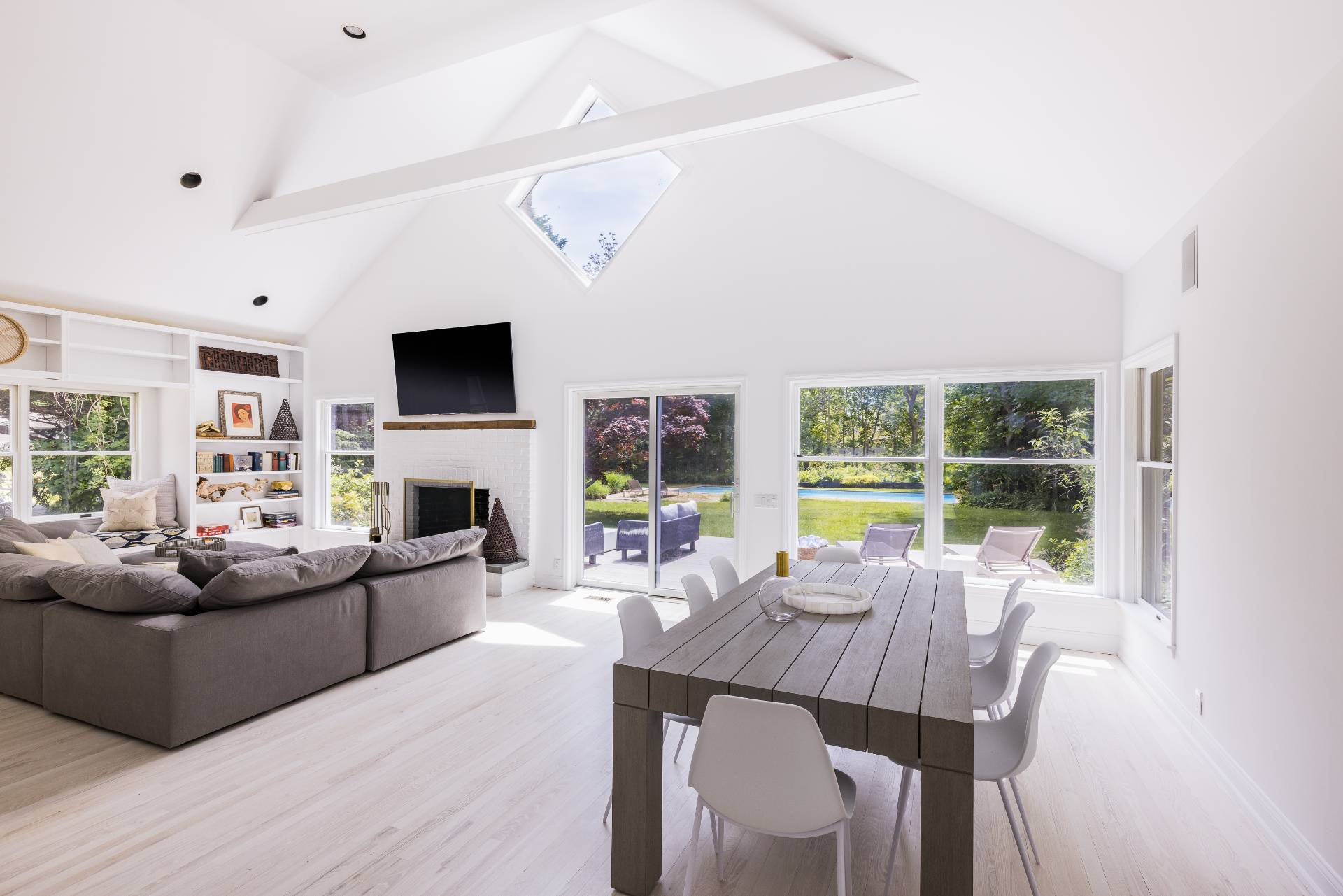73 Accabonac Road East Hampton, NY 11937 - Photo 2 of 13 a living room with fireplace furniture and a large window