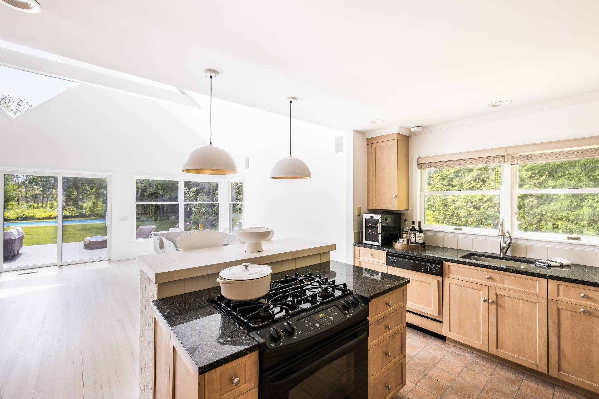 73 Accabonac Road East Hampton, NY 11937 - Photo 3 of 13 a kitchen with a sink stove and cabinets