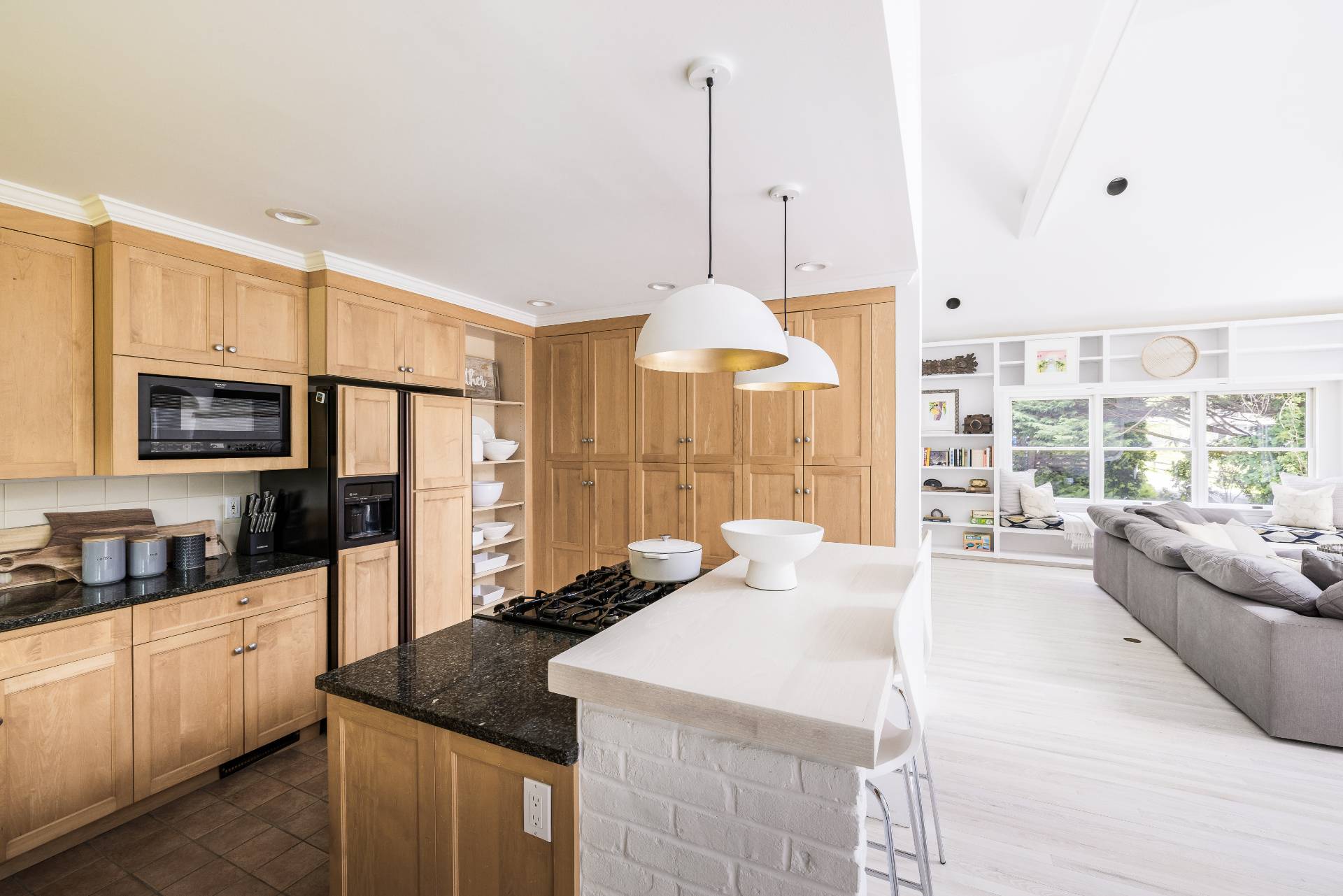73 Accabonac Road East Hampton, NY 11937 - Photo 4 of 13 a large kitchen with kitchen island granite countertop a sink a counter space and stainless steel appliances