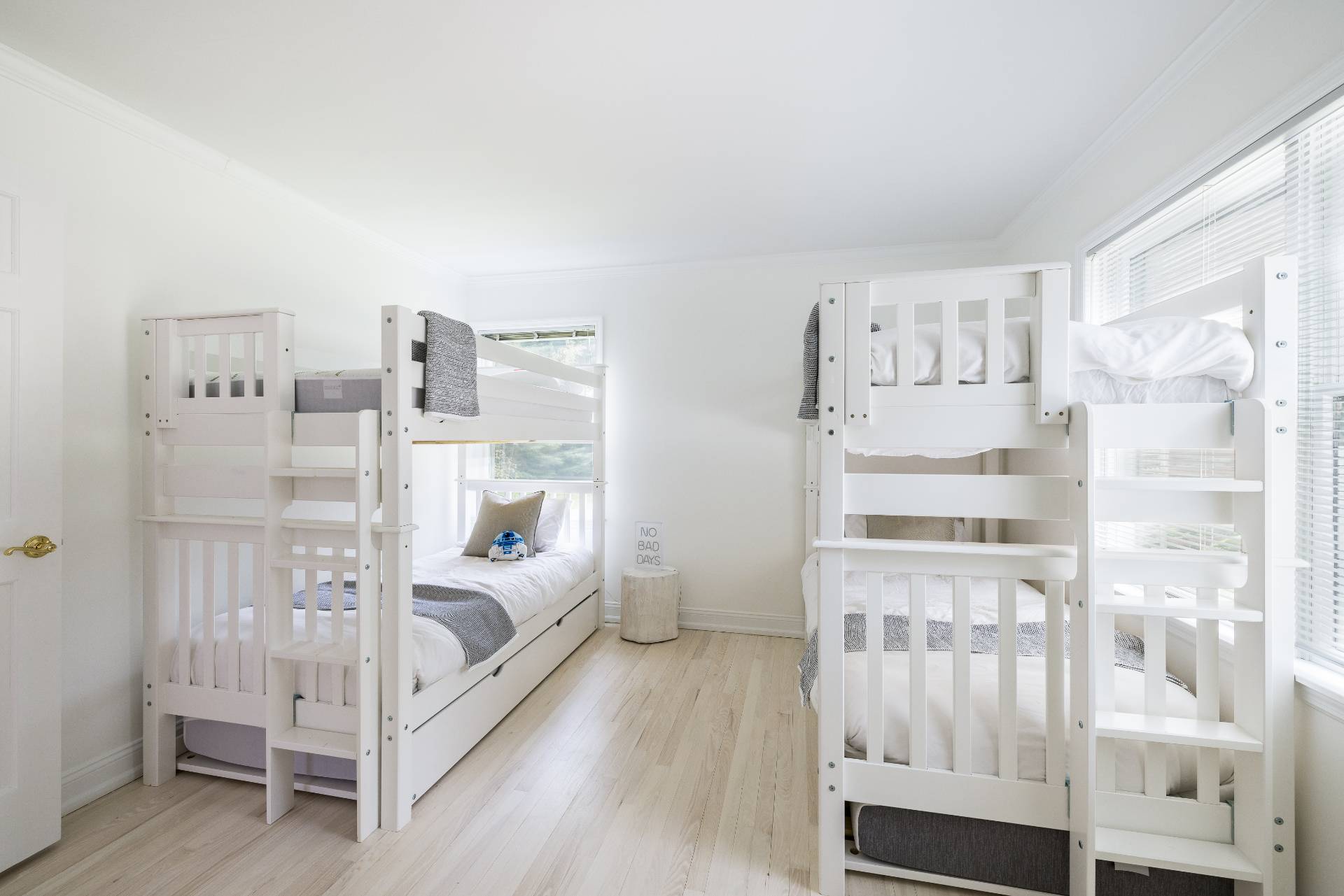 73 Accabonac Road East Hampton, NY 11937 - Photo 9 of 13 a large white bedroom with a bed and a window