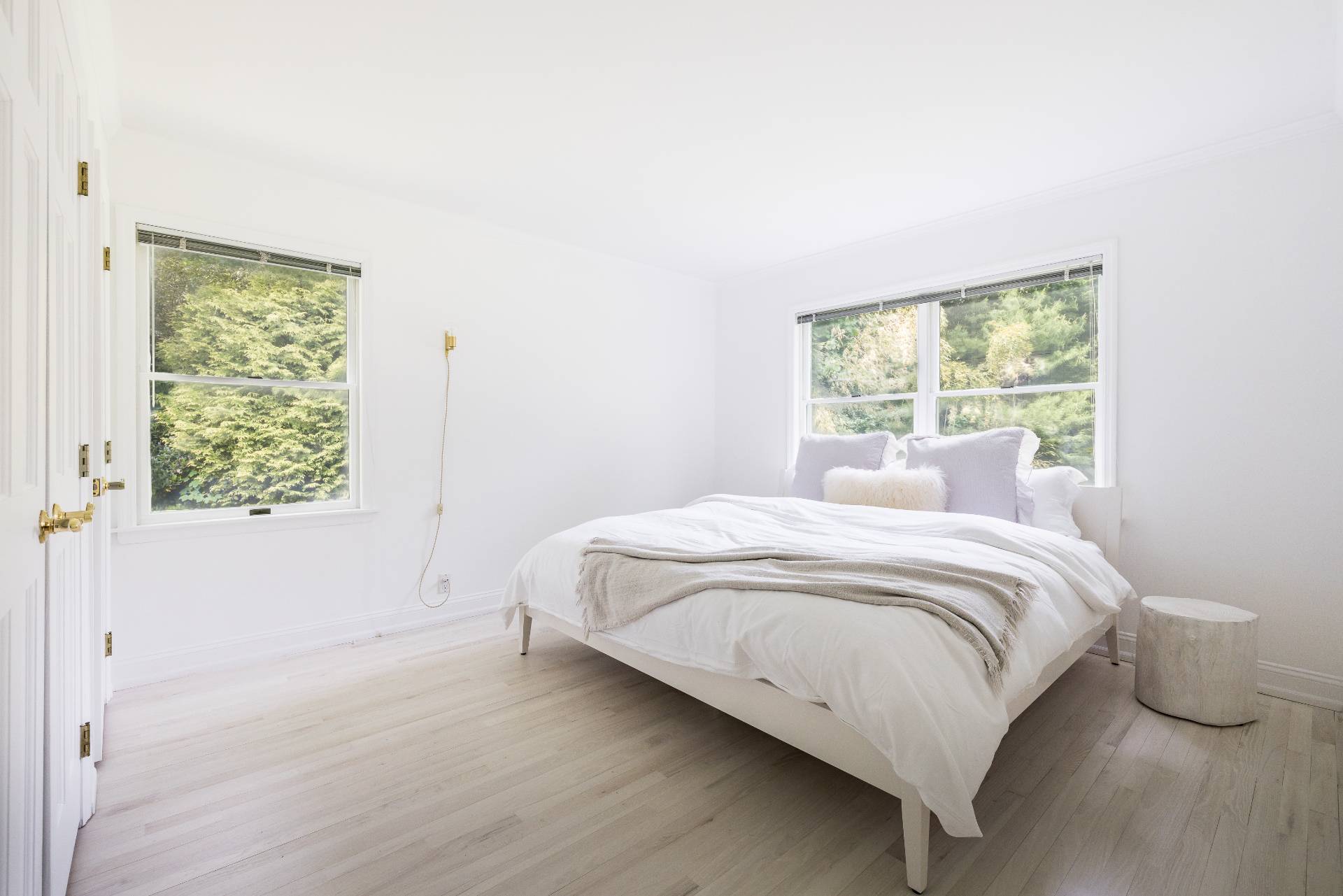 73 Accabonac Road East Hampton, NY 11937 - Photo 10 of 13 a bedroom with a bed and window