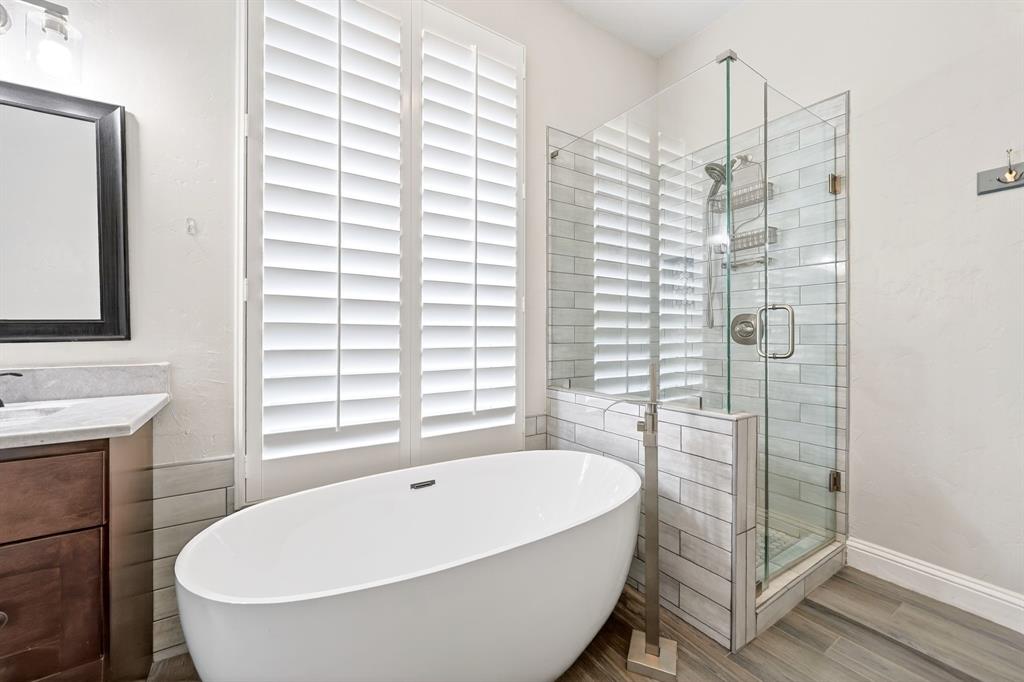 5618 Allen Lane Rowlett, TX 75088 - Photo 20 of 35 a bathroom with a bathtub and shower