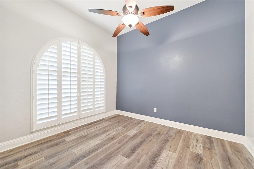 5618 Allen Lane Rowlett, TX 75088 - Photo 24 of 35 an empty room with windows and fan