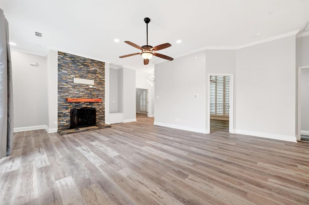 5618 Allen Lane Rowlett, TX 75088 - Photo 4 of 35 a view of empty room with wooden floor ceiling fan and window