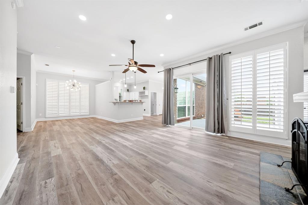 5618 Allen Lane Rowlett, TX 75088 - Photo 5 of 35 a view of an empty room with a window and wooden floor