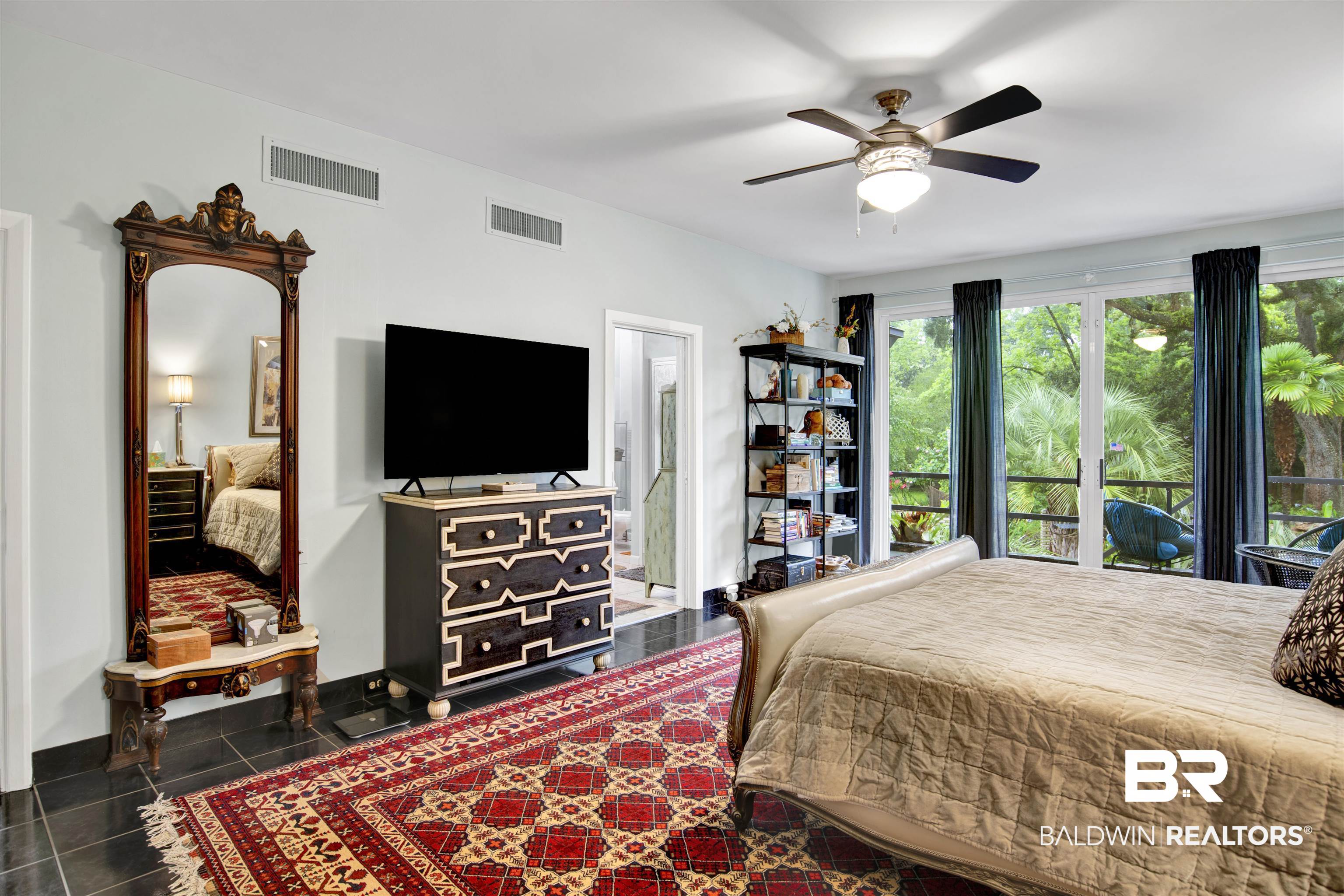809 Bernard Circle Mobile, AL 36693 - Photo 35 of 75 Spacious bedroom featuring dark tile flooring and white walls