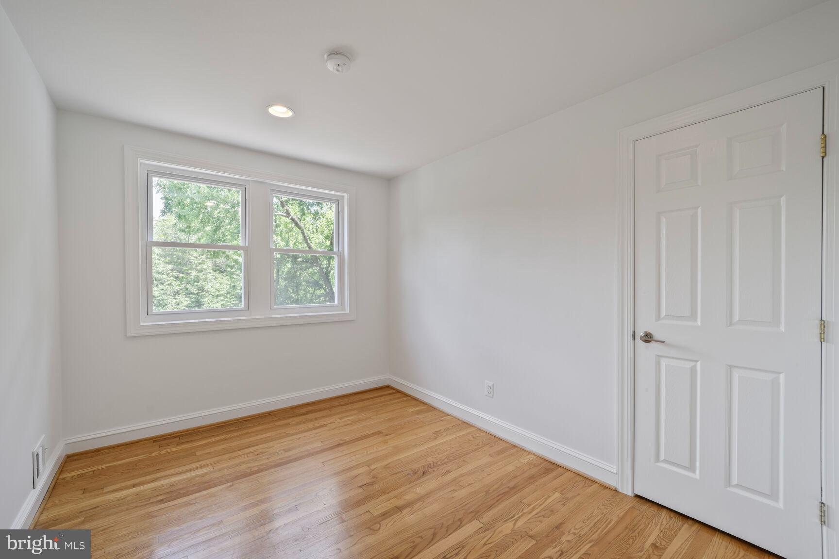 10213 Duvawn Place Silver Spring, MD 20902 - Photo 24 of 37 a view of empty room with wooden floor and fan