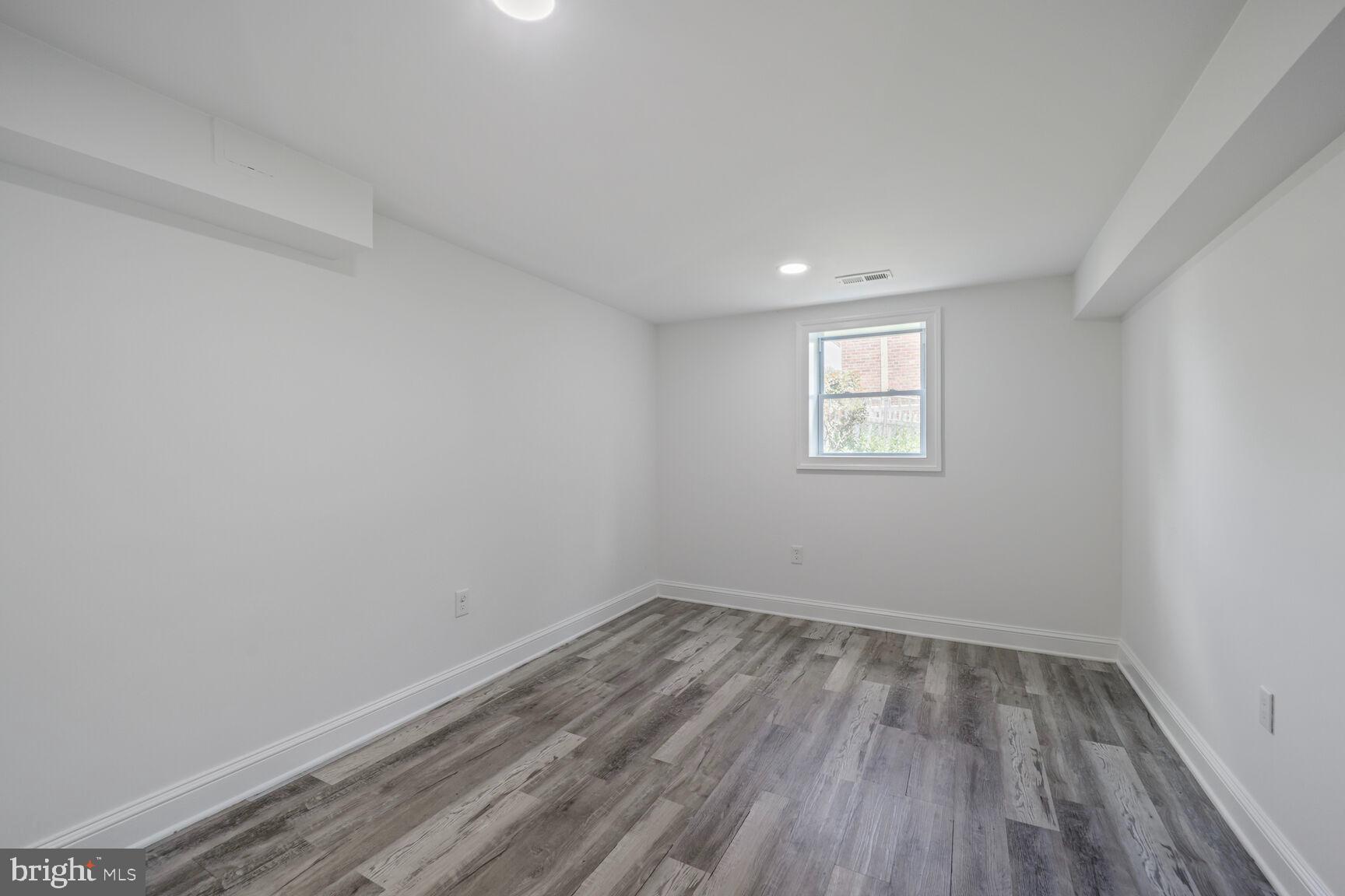 10213 Duvawn Place Silver Spring, MD 20902 - Photo 27 of 37 a view of a room that has wooden floor and window