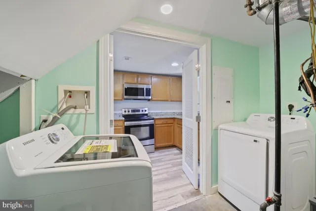 a kitchen that has a sink and a stove in it
