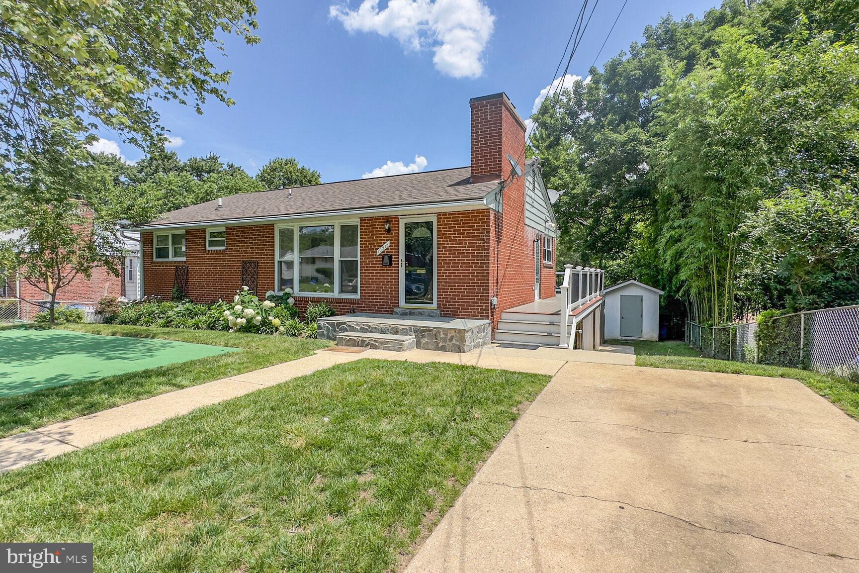 10213 Duvawn Place Silver Spring, MD 20902 - Photo 35 of 37 a front view of a house with garden