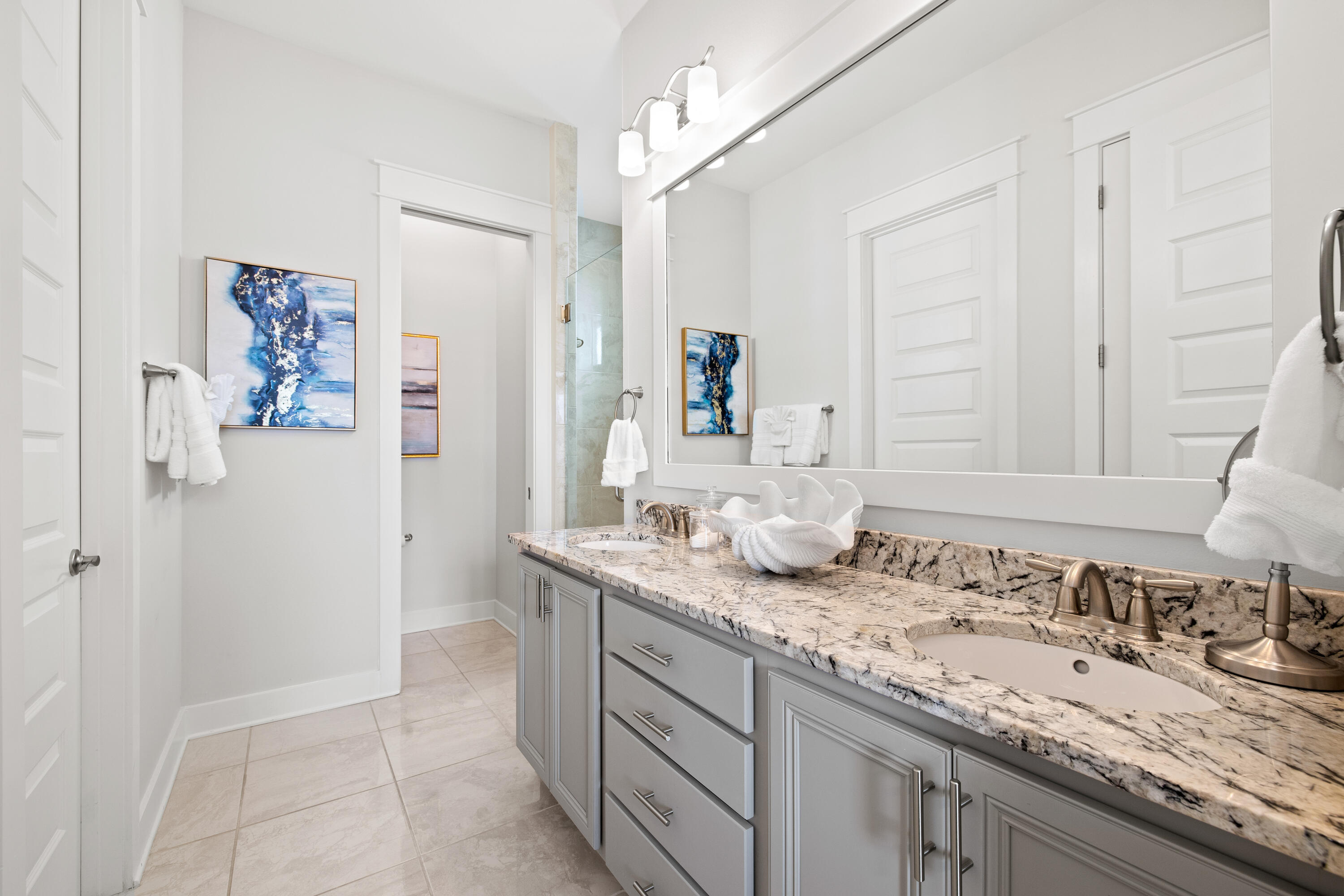 95 York Ln Inlet Beach, Unit C Inlet Beach, FL 32461 - Photo 22 of 36 a bathroom with a granite countertop sink and a mirror