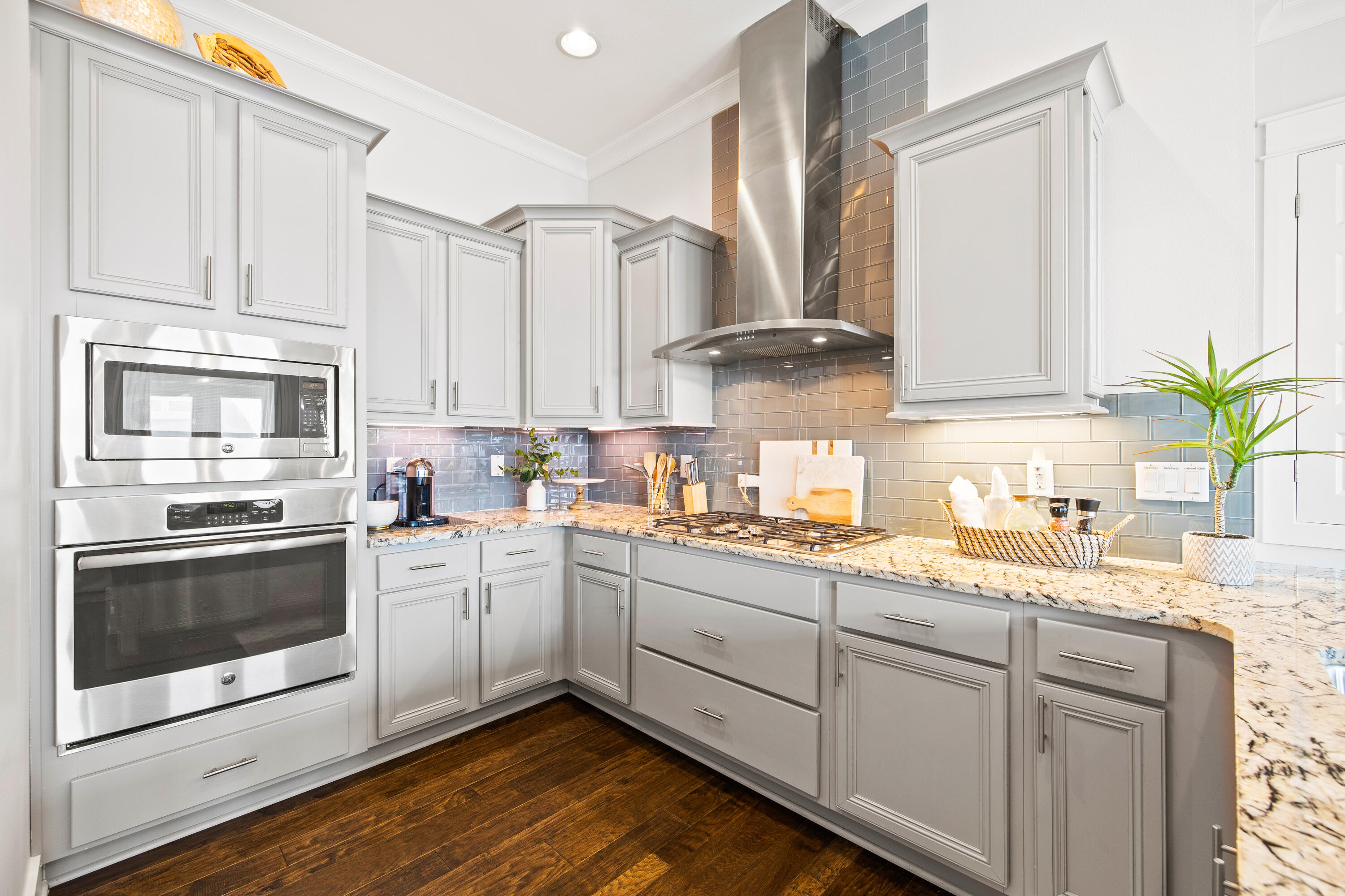 95 York Ln Inlet Beach, Unit C Inlet Beach, FL 32461 - Photo 6 of 36 a kitchen with kitchen island granite countertop a sink stainless steel appliances and white cabinets