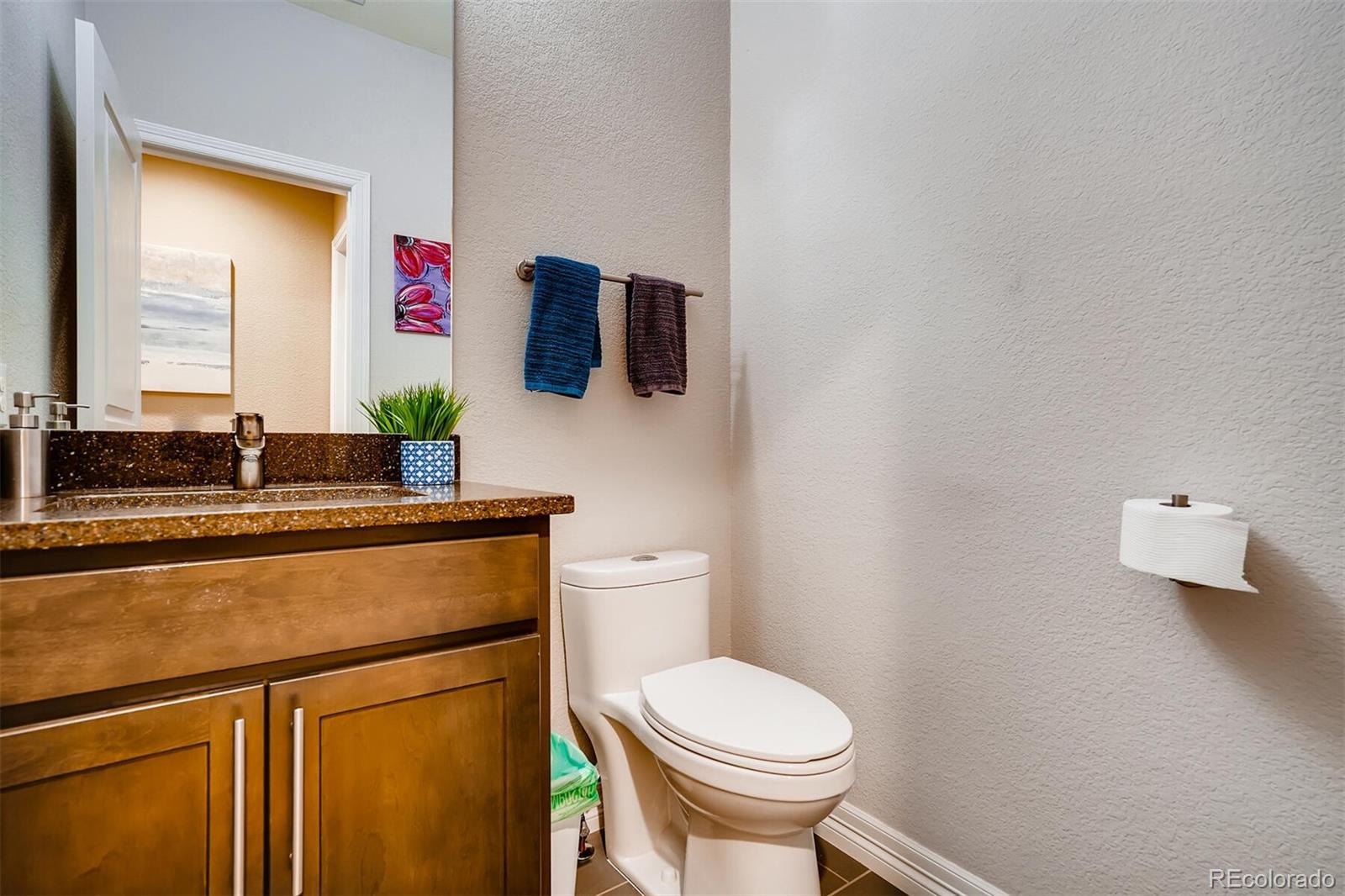 529 Uinta Way Denver, CO 80230 - Photo 12 of 40 a bathroom with a toilet and a sink