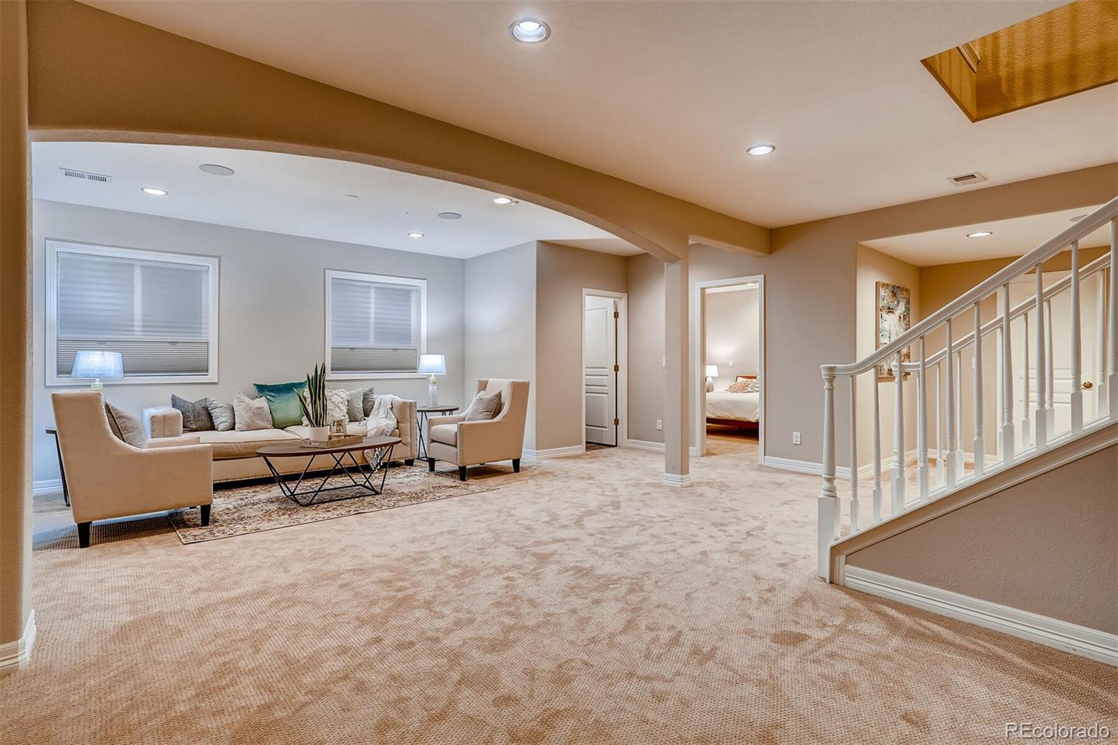 529 Uinta Way Denver, CO 80230 - Photo 27 of 40 a living room with furniture and a couch