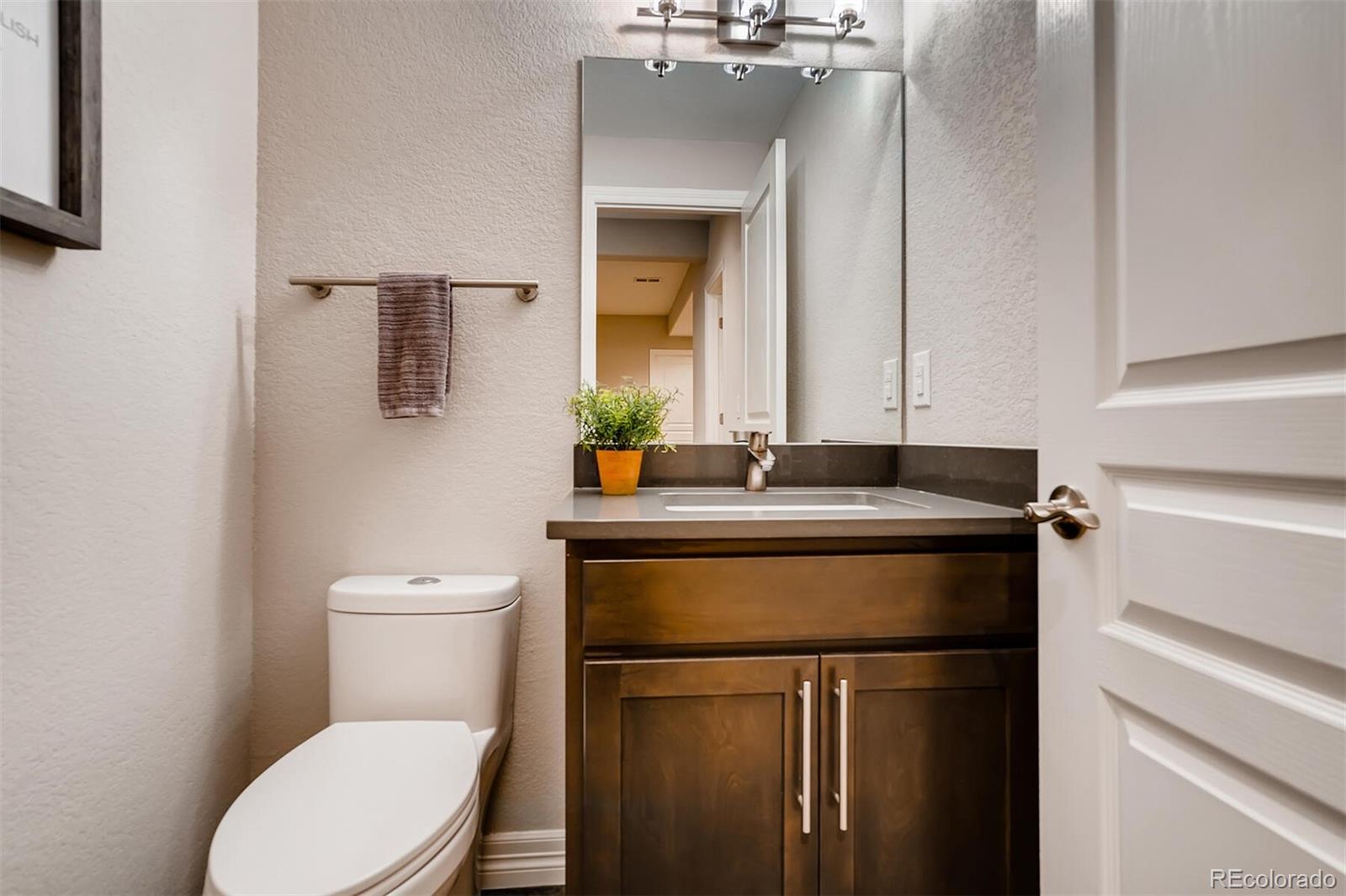 529 Uinta Way Denver, CO 80230 - Photo 28 of 40 a bathroom with a sink vanity and toilet