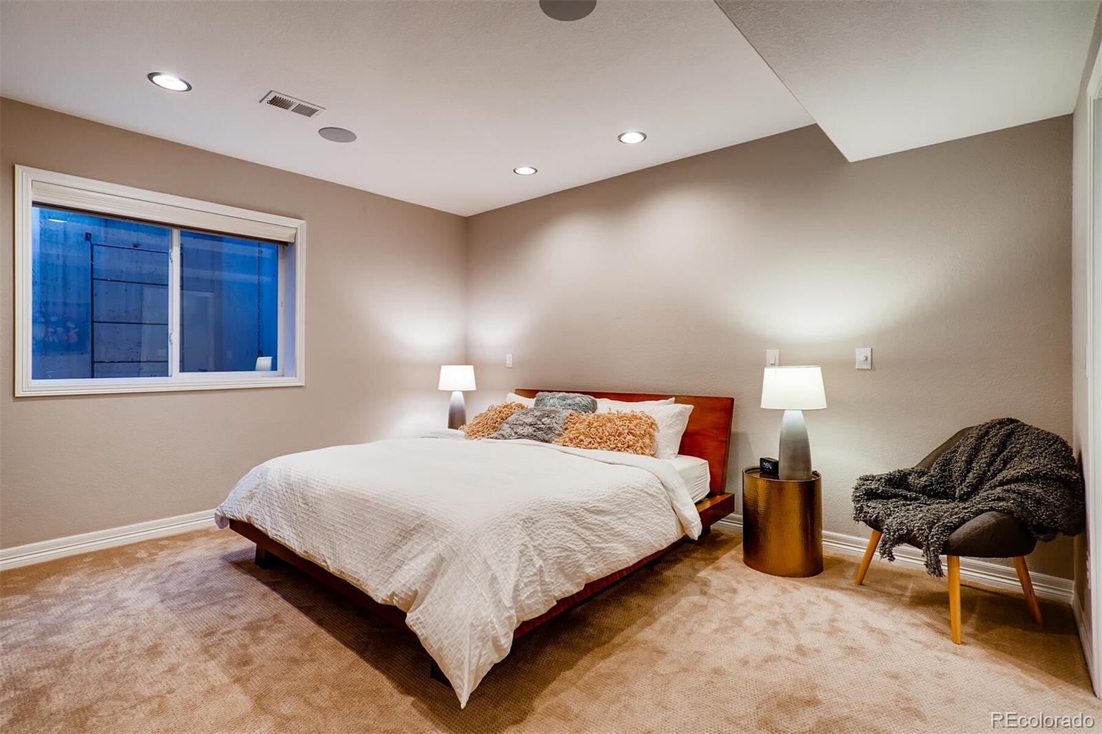 529 Uinta Way Denver, CO 80230 - Photo 29 of 40 a bedroom with a bed and window