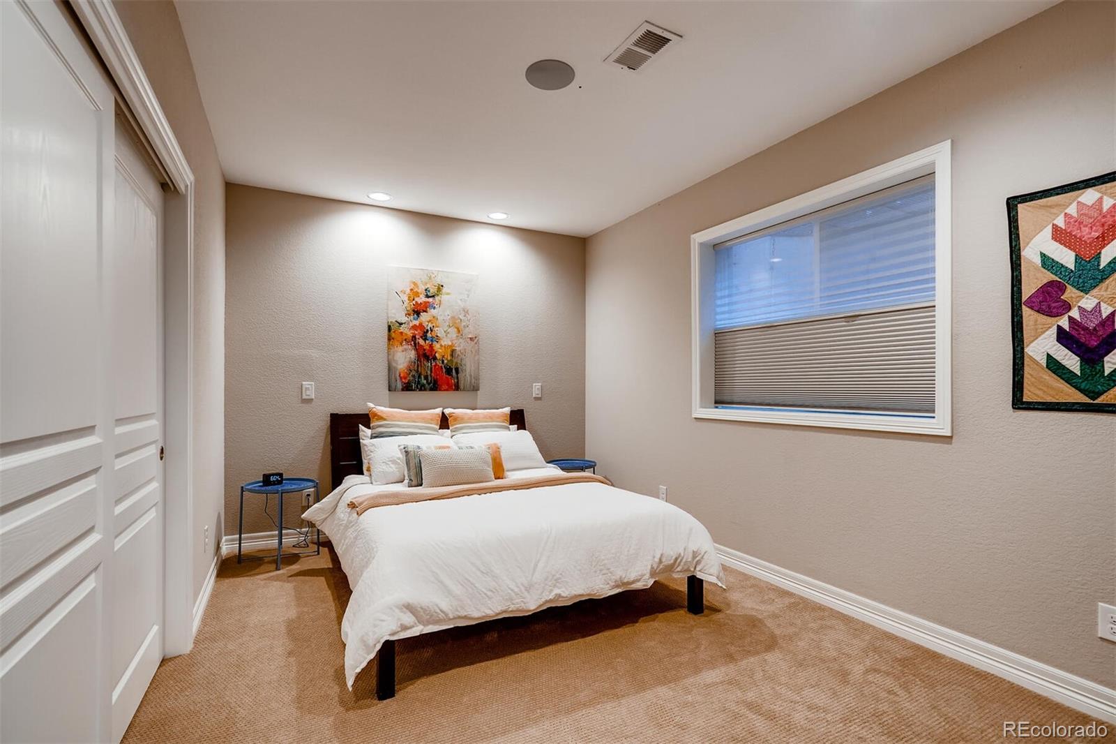 529 Uinta Way Denver, CO 80230 - Photo 33 of 40 a bedroom with a bed and furniture