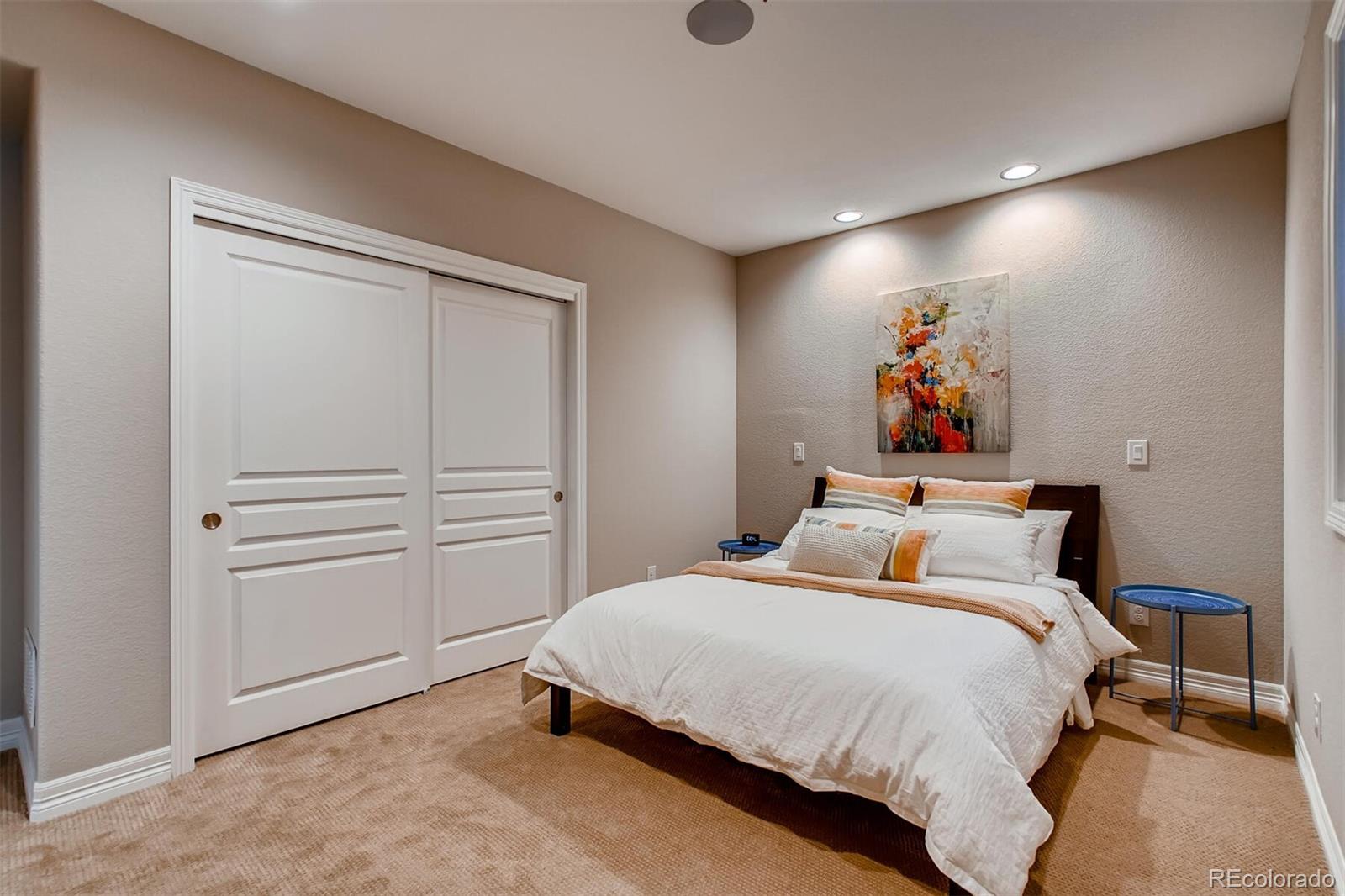 529 Uinta Way Denver, CO 80230 - Photo 34 of 40 a bed room with a bed and with furniture