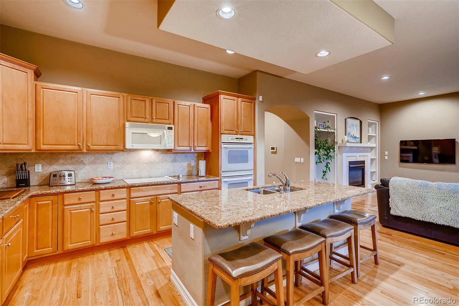529 Uinta Way Denver, CO 80230 - Photo 6 of 40 a kitchen with granite countertop a sink and counter space