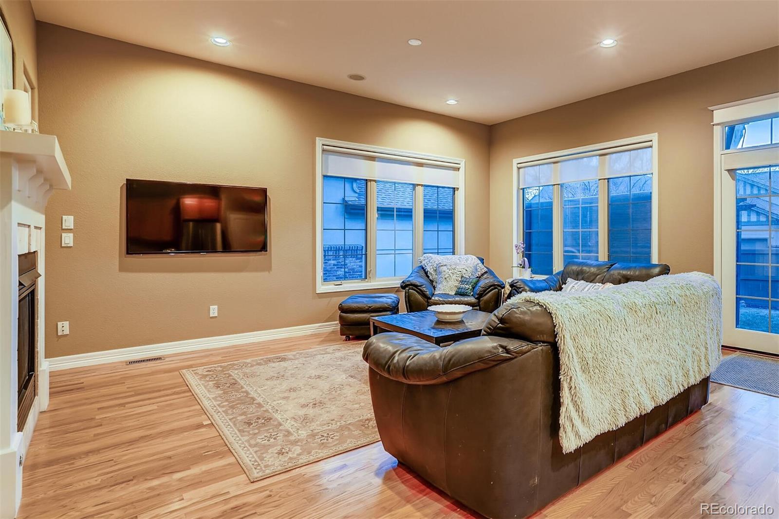 529 Uinta Way Denver, CO 80230 - Photo 10 of 40 a living room with furniture and a flat screen tv