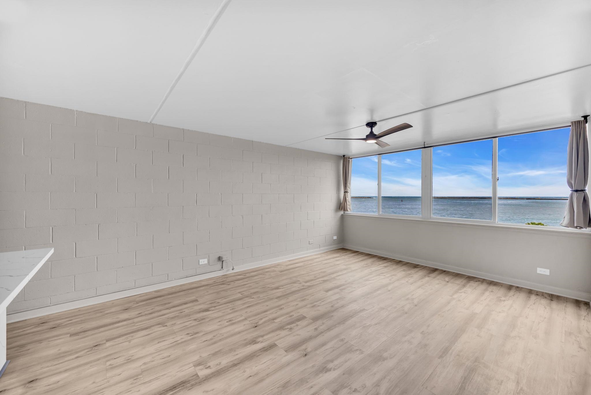 111 Kahului Beach Road, Unit A310 Kahului, HI 96732 - Photo 7 of 24 a view of an empty room with a window and wooden floor