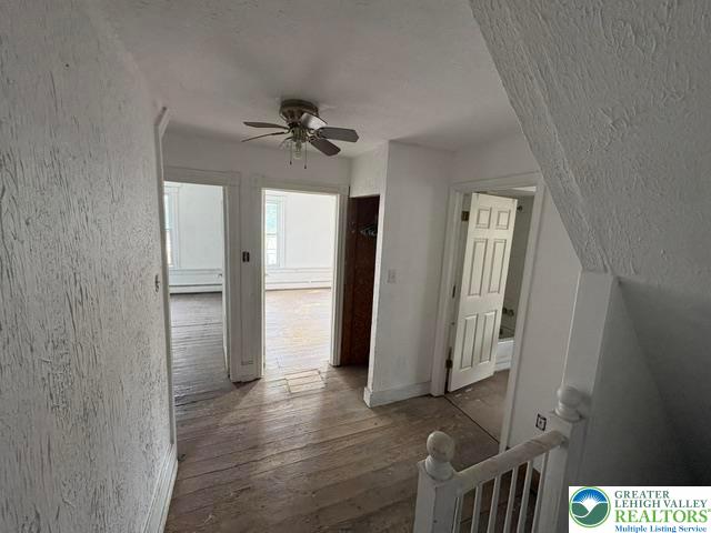 581 Mauch Chunk Road Palmerton, PA 18071 - Photo 12 of 27 Original wood floors and textured plaster walls add historic character to this upper landing.