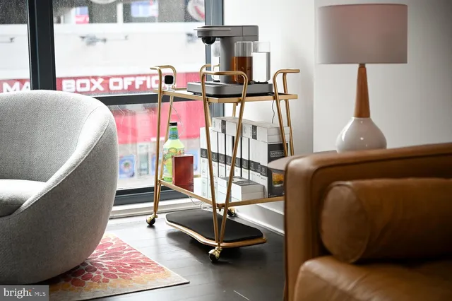 a bedroom with furniture and a flat screen tv