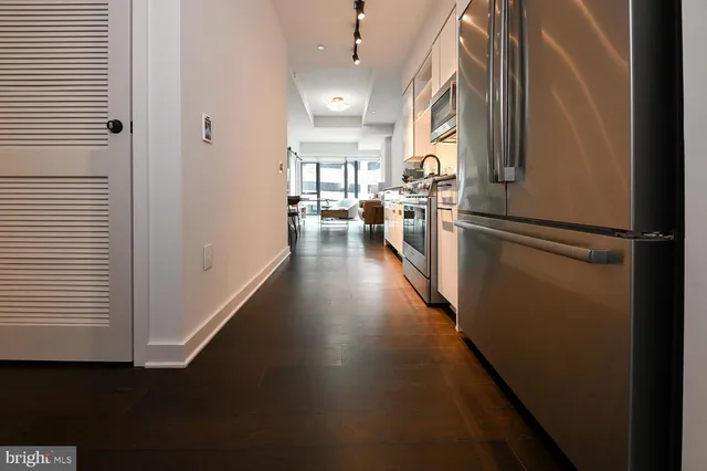 a stove top oven sitting inside of a kitchen