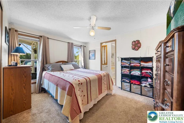 a bedroom with a bed and dresser