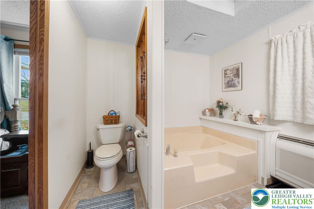 6149 Snyders Church Road, Unit TRL#28 Bath, PA 18014 - Photo 19 of 43 a bathroom with a sink and a toilet