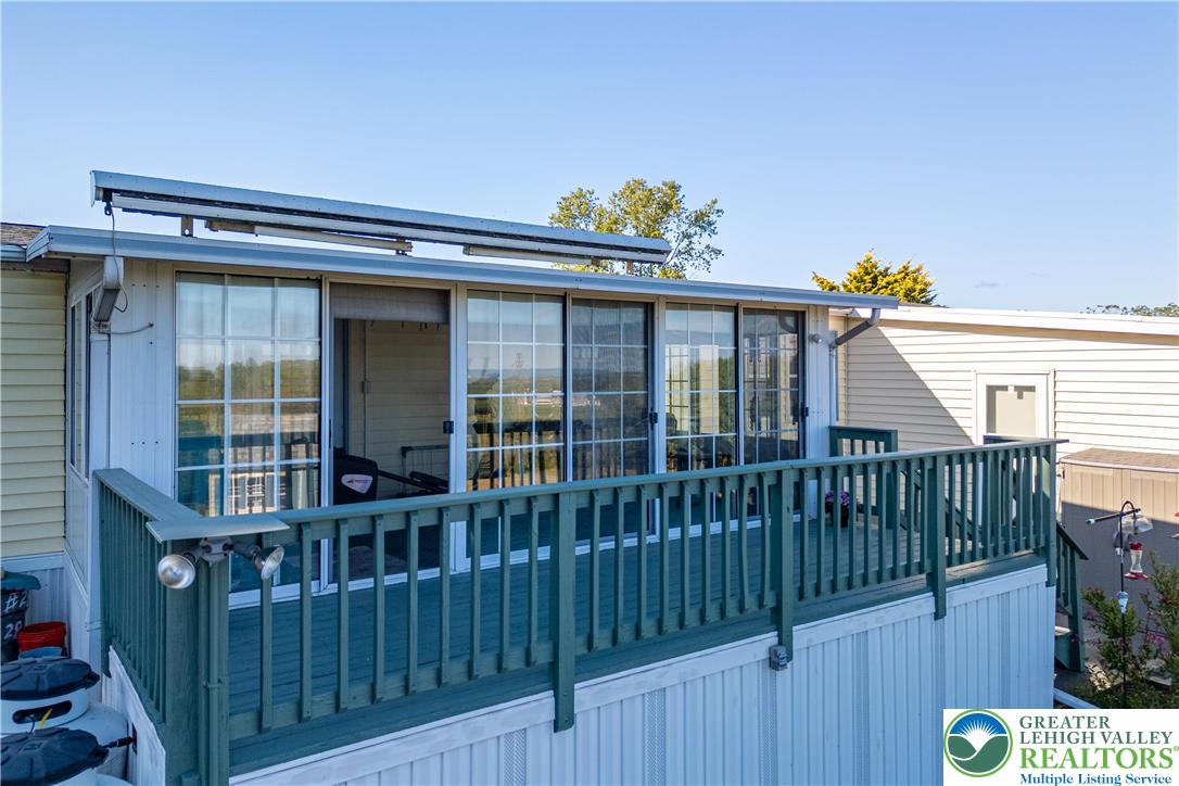 6149 Snyders Church Road, Unit TRL#28 Bath, PA 18014 - Photo 31 of 43 a view of a wooden deck and a floor to ceiling window