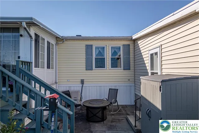 a view of a chair and tables in the balcony
