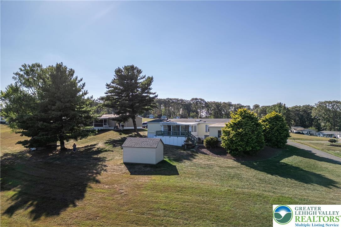 6149 Snyders Church Road, Unit TRL#28 Bath, PA 18014 - Photo 37 of 43 a view of a lake with couches