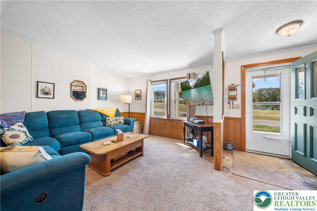 6149 Snyders Church Road, Unit TRL#28 Bath, PA 18014 - Photo 6 of 43 a living room with furniture and a window