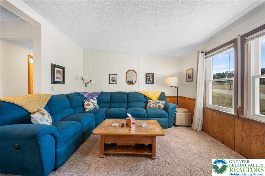 6149 Snyders Church Road, Unit TRL#28 Bath, PA 18014 - Photo 7 of 43 a living room with furniture and a window