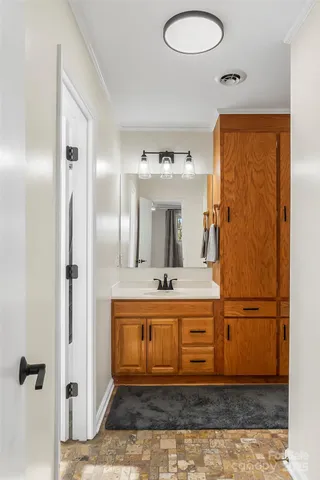 a view of a bathroom with a sink mirror and shower
